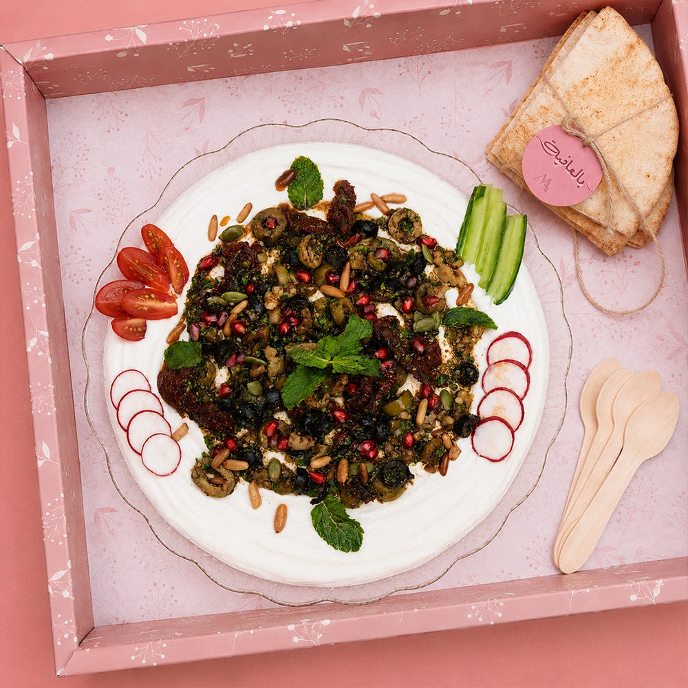 Mazzah Labneh Platter with fresh labneh, olive oil and garnish — overhead view